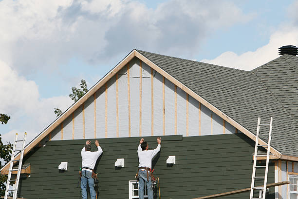 Professional Siding technician working in Covington, TN